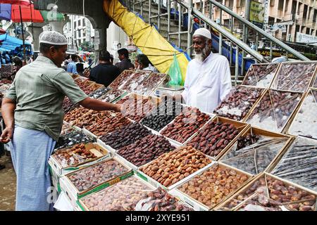 A Bangladeshi shopkeeper is displaying dates for sale, shopkeeper