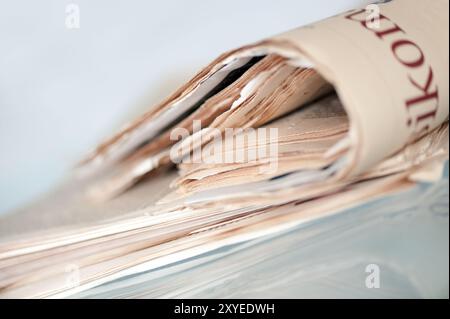 A pile of old yellowed daily newspapers Stock Photo