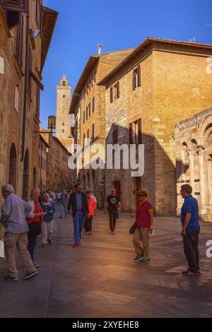 San Gimignano, Tuscany, Italy, October 25, 2018: Old street in typical Tuscan medieval town, popular tourist destination, Europe Stock Photo