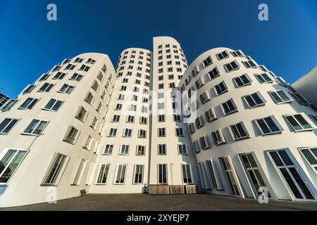 General view of the Gehry building Zollhof in the media harbour in sunshine and blue sky Stock Photo