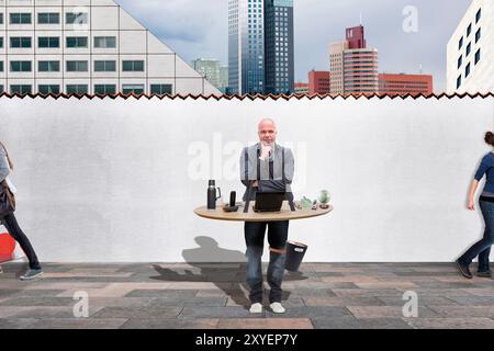 Employee with mobile workplace, symbolic image Stock Photo