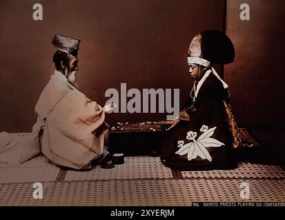 Men playing Go ( encirclement board game ) 1890 by Kusakabe Kimbei Japanese hand-coloured black and white photo Japan late 19th - beginning of 20th-century vintage albumen photograph ( Historic History ) digital improved reproduction . Stock Photo