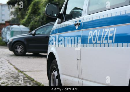 Parked police car during a police operation Stock Photo