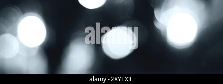Blurred lights, gray, deep blue background, banner texture. Abstract bokeh with soft light header. Wide screen wallpaper. Panoramic web banner with co Stock Photo