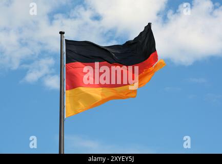 Flag of the Federal Republic of Germany on the flagpole Stock Photo