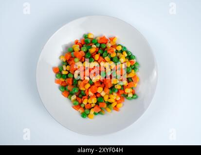 Organic Food. Mixed Vegetables Isolated White Background. Vegetable containing carrots, peas, and corn on white background, Healthy food, Colorful mix Stock Photo