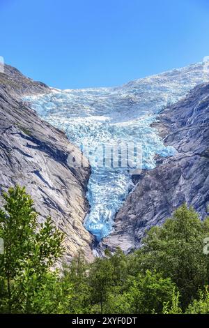 Briksdal or Briksdalsbreen glacier with melting blue ice, Norway nature landmark close-up view Stock Photo