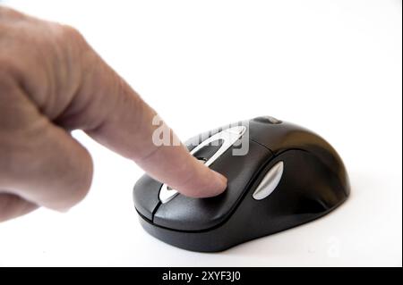Index finger presses the mouse button Stock Photo