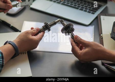 The factory mechanical engineering team is designing and developing gear sets to keep the machines running perfectly because gear sets are essential i Stock Photo