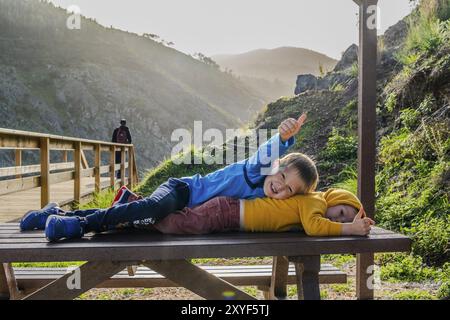 Two small brothers having fun on walk in the mountains, Alferce, Algarve, Portugal, Europe Stock Photo