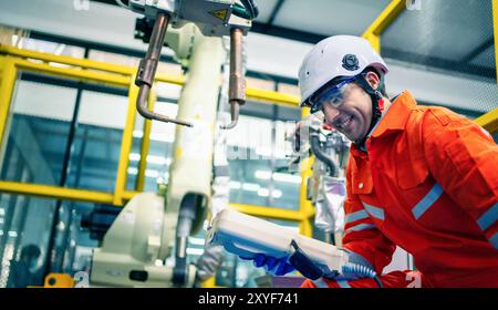 Mechanical engineering team working in robotic technology lap for research and develop for manufacturing automation and robotics. Stock Photo