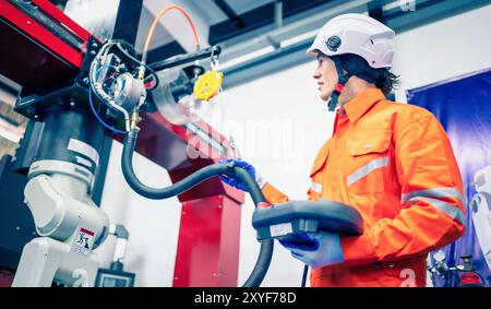 Mechanical engineer using coordinate measuring machine CMM measurement technologies at production line in the industry factory. Stock Photo