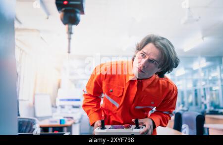 Mechanical engineer using coordinate measuring machine CMM measurement technologies at production line in the industry factory. Stock Photo
