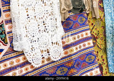 Tablecloths with colorful patterns. Assortment of a gift shop in Turkey. Close up photo with selective soft focus Stock Photo