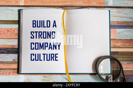 Symbol of company culture. Notepad with words. Create a strong company culture. Business and company culture concept. Stock Photo