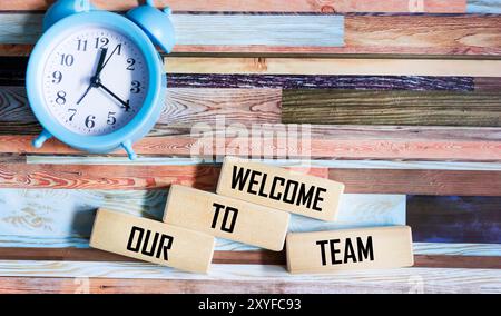 Welcome to our team symbol. Concept words Welcome to our team on wooden blocks. Stock Photo