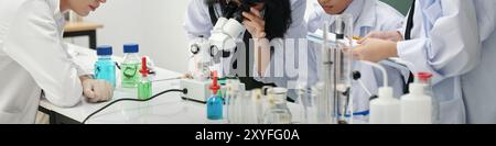 Conducting Experiment in Science Laboratory with Students Stock Photo
