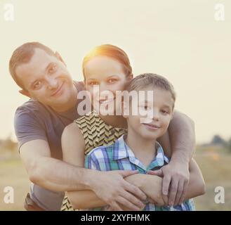 Happy young family with little son outdoors Stock Photo