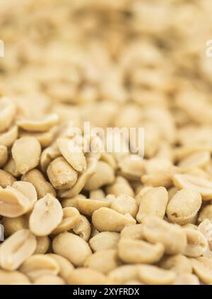 Roasted and salted Peanuts on vintage background (close-up shot, selective focus) Stock Photo