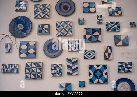 Greek style ceramic blue and white tiles on a wall Stock Photo