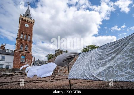 Lympstone, UK. 29th Aug, 2024. The tradition of residents drying washing on the foreshore of Lympstone in Devon. Credit: Thomas Faull/Alamy Live News Stock Photo