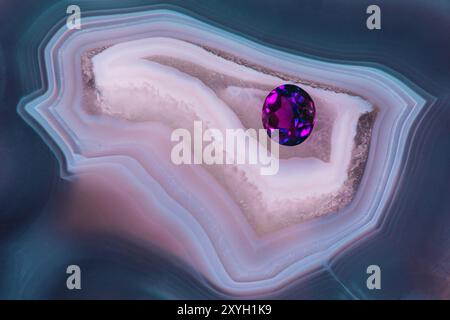 Gorgeous Amethyst Gemstone on a Beautifully Patterned Agate Thunderegg Stock Photo