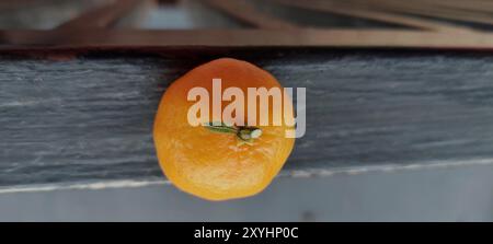 Fresh Sicilian oranges, mandarins on black iron background Stock Photo