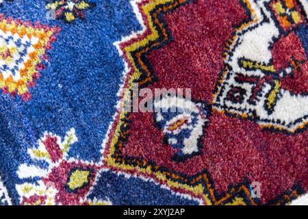 Woolen carpet with oriental ornament. Close-up photo Stock Photo