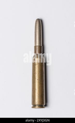 Old rifle bullet from the 1950s on white background Stock Photo