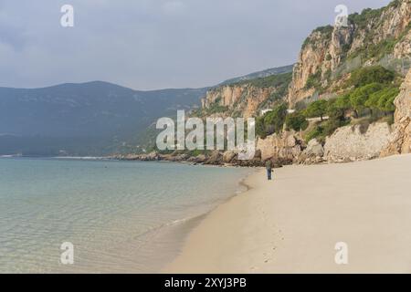 Man walking in Figueirinha beach in Arrabida park Stock Photo