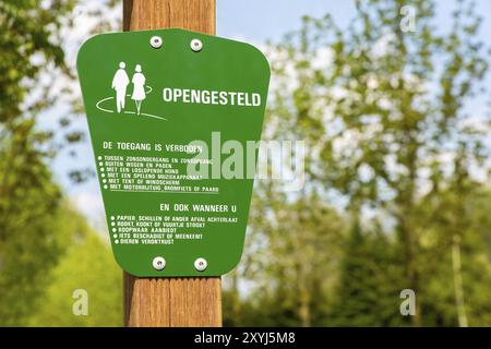 Green traffic sign for behaviour of dutch walkers in forest Stock Photo