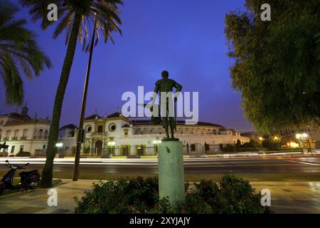 Torrero monument in front of Plaza de Toros in Sevilla at night Stock Photo