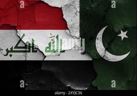 Flags of Iraq and Pakistan painted on cracked wall Stock Photo