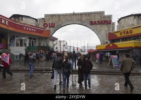 Bishkek, Kyrgyzstan, October 02, 2014: People on their way to and from the entrance of Osh Bazar, Asia Stock Photo