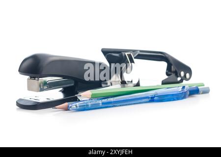 Office equipment. Stapler, pencils and hole puncher isolated on a white background. Stock Photo