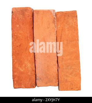 Side view of old red or orange bricks in stack is isolated on white background. Stock Photo