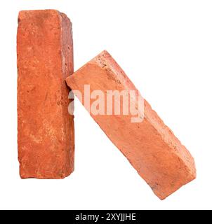 Side view of old red or orange bricks in stack is isolated on white background. Stock Photo