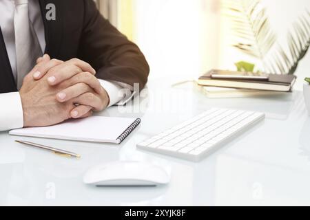 Male businessman seating at the table modern computer notepads business concept close up Stock Photo