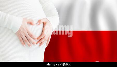 Demographics, pregnancy and love baby in Poland concept. Pregnant woman making heart against her stomach on Polish flag background. Stock Photo