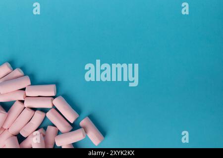 Detailed aerial shot showing a chaotic arrangement of marshmallows occupying the left section of the image. The horizontal layout features a striking Stock Photo