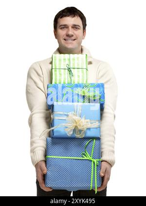 Happy smiling young man with presents. Isolated on white Stock Photo