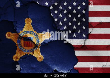 Flags of United States Secret Service and USA painted on cracked wall Stock Photo