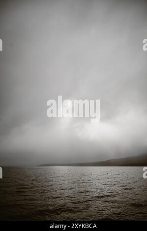 Dramatic vertical landscape of water and gray clouds at Lake Tahoe Stock Photo