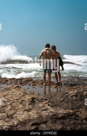 Friends hugging on the beach. Stock Photo