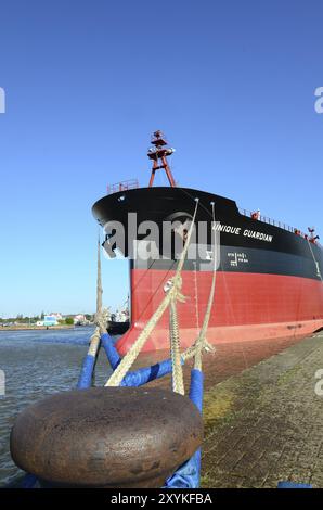 The oil tanker Unique Guardian is moored at the quay wall. Oil tanker Unique Guardian in harbour Stock Photo