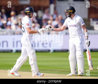 England's Gus Atkinson (right) and Matthew Potts (left) prepare to bat during day two of the second Rothesay Men's Test match at Lord's, London. Picture date: Friday August 30, 2024. Stock Photo