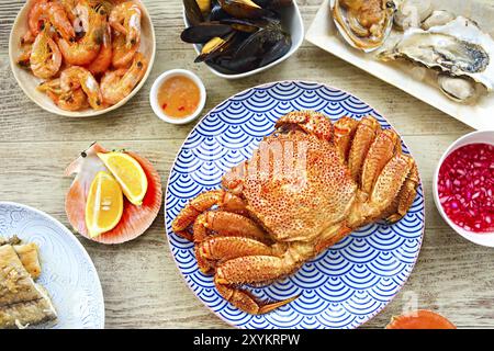 Freshly variety of sea food on the gray kitchen table. Top view Stock Photo