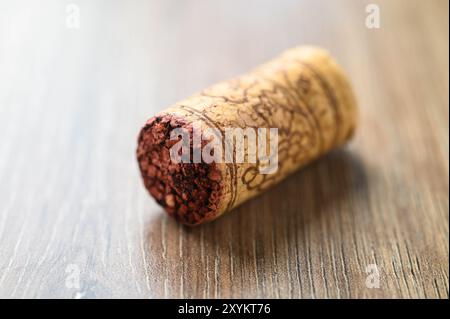 Close-up of used wine cork on wooden background Stock Photo