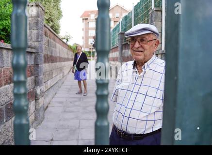 Older couple at the entrance of their house. Family life Stock Photo
