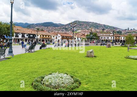 CUSCO, PERU, JANUARY 26, 2016 : People at the Main Square Plaza de Armas with the Statue of Pachacuti and cityscape of Cusco in Peru Stock Photo